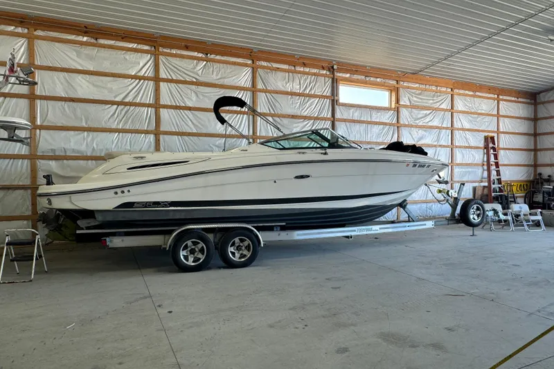 Slide: The Image of 2007 Sea Ray 270 SLX boat on trailer in indoor storage facility. - 33