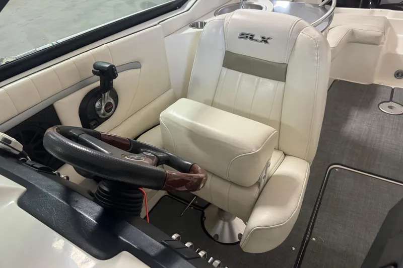 Slide: The Image of 2007 Sea Ray 270 SLX boat interior with steering wheel and captain's seat. - 15