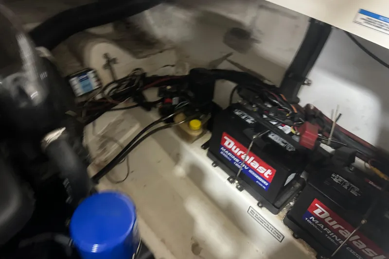 Slide: The Image of Engine compartment of a 2007 Sea Ray 270 SLX with Duralast marine batteries. - 34