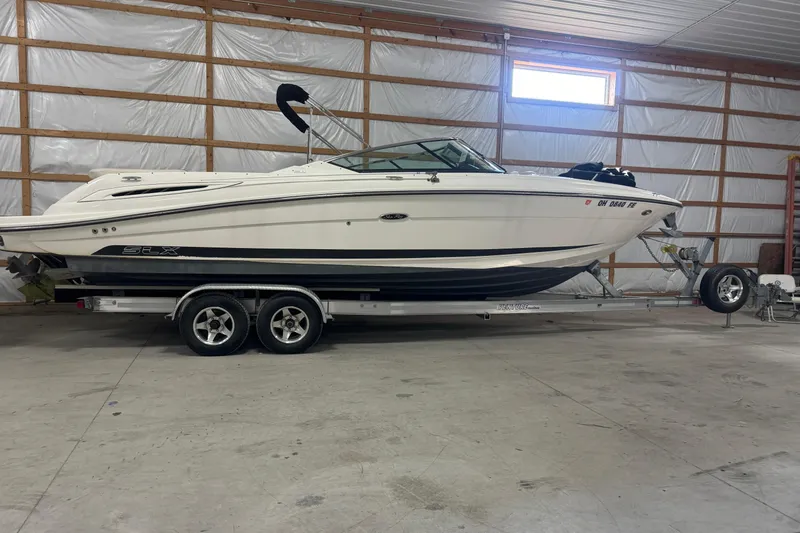 Slide: The Image of 2007 Sea Ray 270 SLX boat on trailer in indoor storage facility. - 32