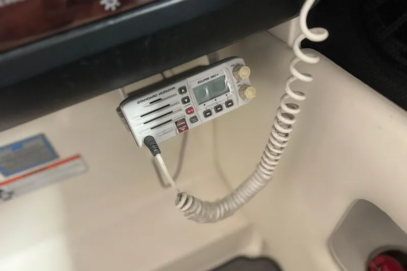 Slide: The Image of VHF radio installed on a 2007 Sea Ray 270 SLX boat dashboard. - 14