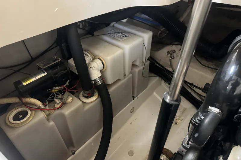 Slide: The Image of Engine compartment of a 2007 Sea Ray 270 SLX boat, showing mechanical components and wiring. - 23