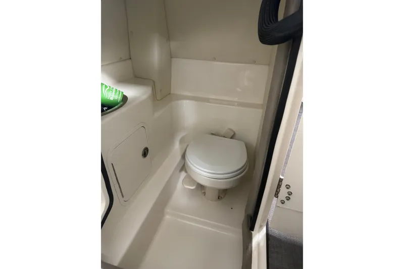 Slide: The Image of 2007 Sea Ray 270 SLX boat interior with compact marine toilet. - 38