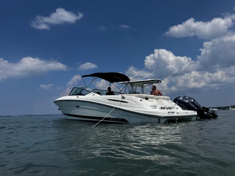 Slide: The Image of 2007 Sea Ray 270 SLX boat on water under a partly cloudy sky. - 29