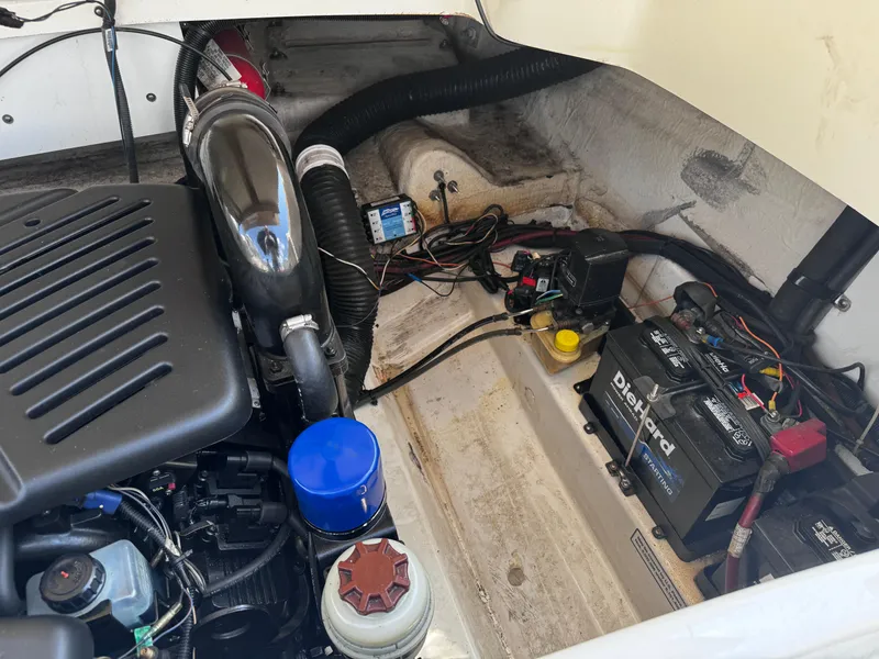 Slide: The Image of Engine compartment of a 2007 Sea Ray 270 SLX boat, showing batteries and wiring. - 17