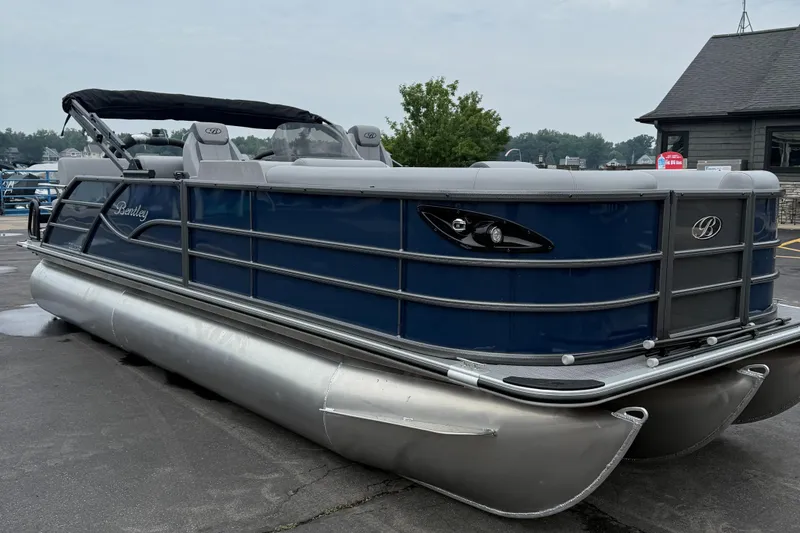 The Image of 2026 Bentley Pontoons 223 Quad Swingback, blue exterior, parked on pavement. - 0