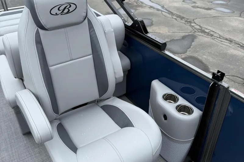Slide: The Image of 2026 Bentley Pontoons 223 Quad Swingback seat with cup holders, featuring sleek gray upholstery. - 12