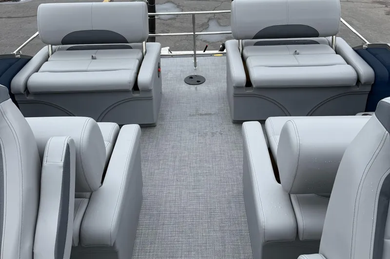 Slide: The Image of 2026 Bentley Pontoons 223 Quad Swingback interior with luxurious seating arrangement. - 14