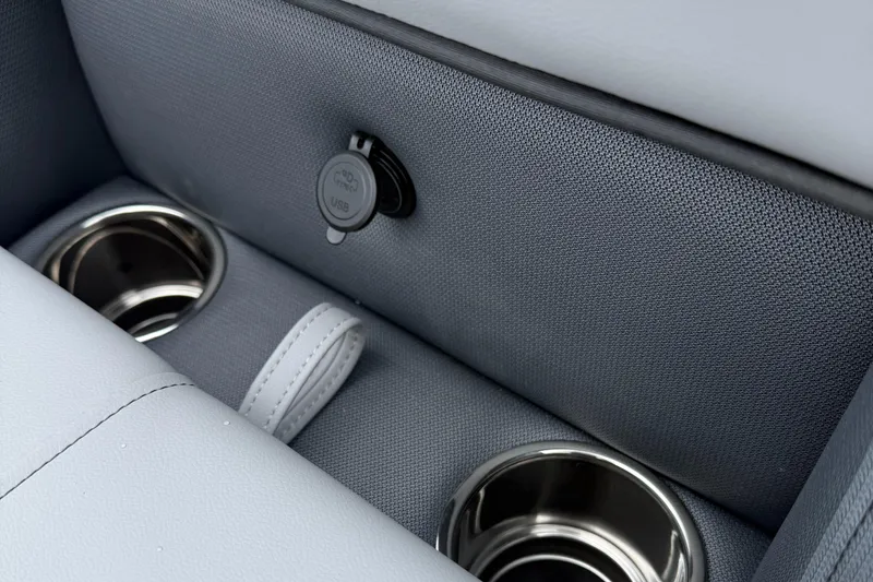 Slide: The Image of 2026 Bentley Pontoons 223 Quad Swingback interior with cup holders and USB port. - 18