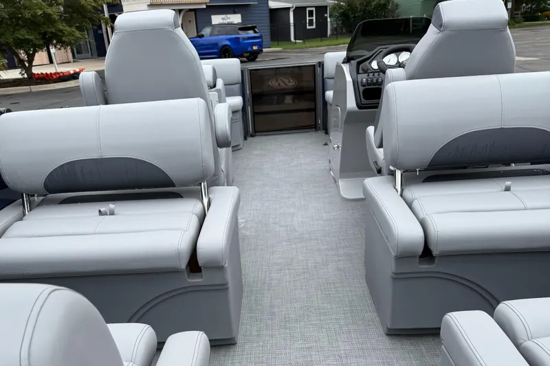 Slide: The Image of Interior of 2026 Bentley Pontoons 223 Quad Swingback with gray seating and dashboard. - 20
