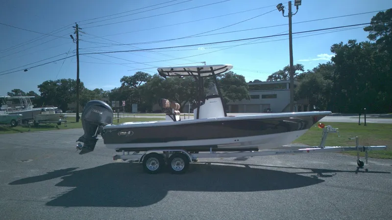 The Image of 2026 Sea Hunt BX22BR boat on trailer, parked outdoors under clear sky. - 0