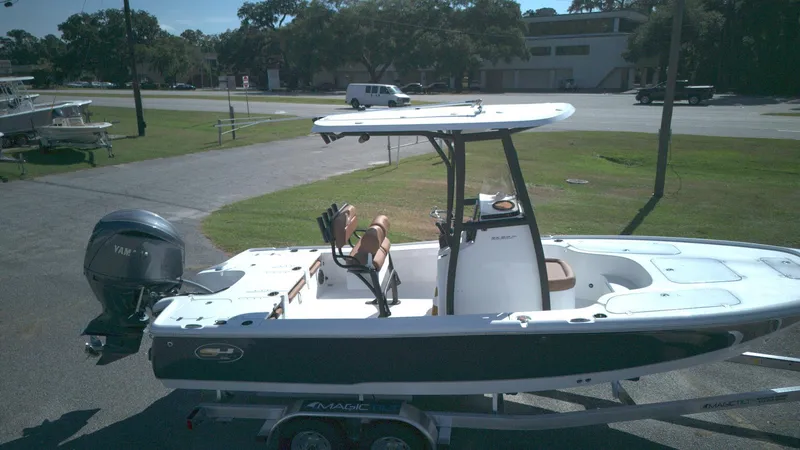 Slide: The Image of 2026 Sea Hunt BX22BR boat on trailer, featuring Yamaha outboard motor. - 10