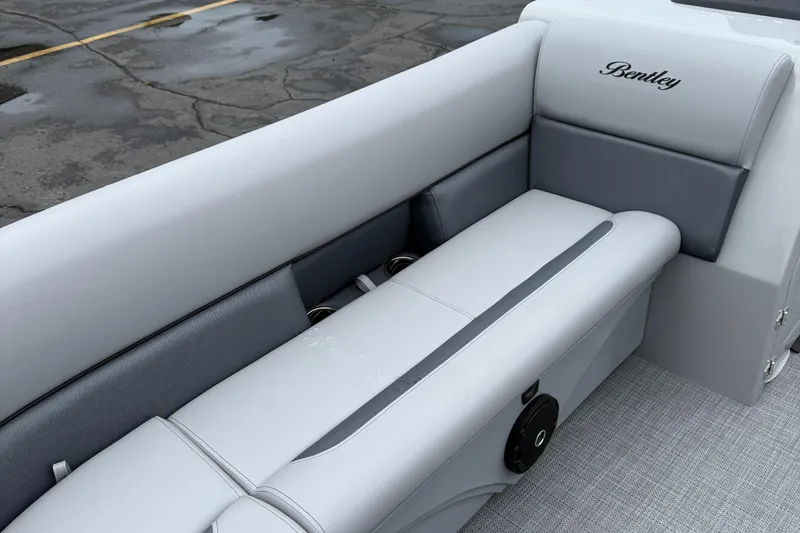 Slide: The Image of 2026 Bentley Pontoons Legacy 240 Cruise XL interior with gray seating and logo. - 9