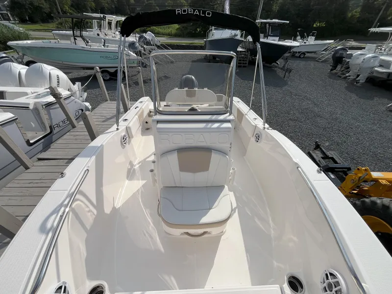 Slide: The Image of 2025 Robalo R180 Center Console boat storage compartment with open hatch. - 10