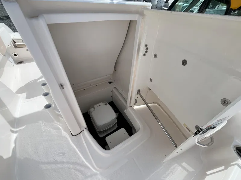 Slide: The Image of 2025 Robalo R180 Center Console boat interior with seating and storage compartments. - 11
