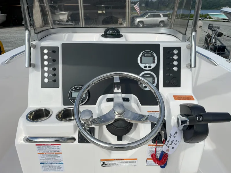 Slide: The Image of 2025 Robalo R180 Center Console boat interior with seating and storage compartments. - 6