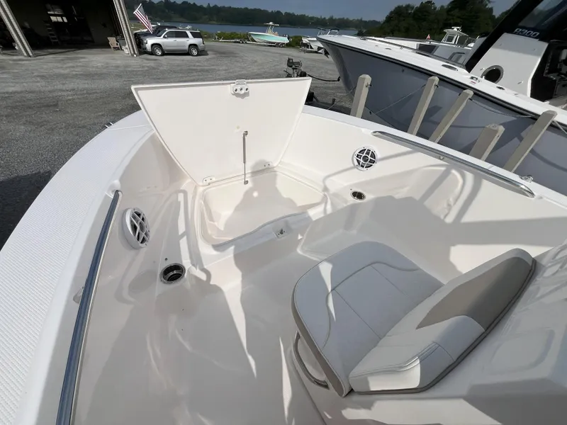 Slide: The Image of Open storage compartment on 2025 Robalo R180 Center Console boat. - 8