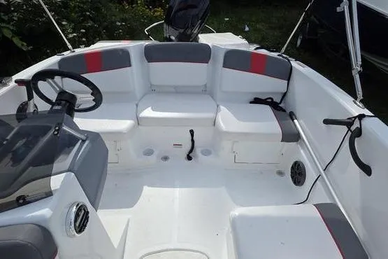 Slide: The Image of 2023 Tahoe T16 boat interior with seating and steering wheel. - 10