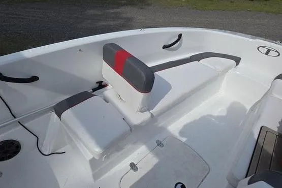 Slide: The Image of 2023 Tahoe T16 boat interior with white and gray seating, featuring red accents. - 12