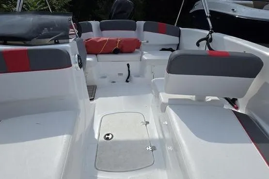 Slide: The Image of 2023 Tahoe T16 boat interior with gray and red seating, open deck layout. - 15
