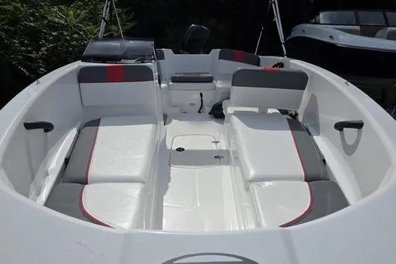 Slide: The Image of 2023 Tahoe T16 boat interior with white and gray seating, red accents, and spacious layout. - 5
