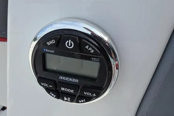 Slide: The Image of 2023 Tahoe T16 audio control panel with Kicker Bluetooth system and digital display. - 9