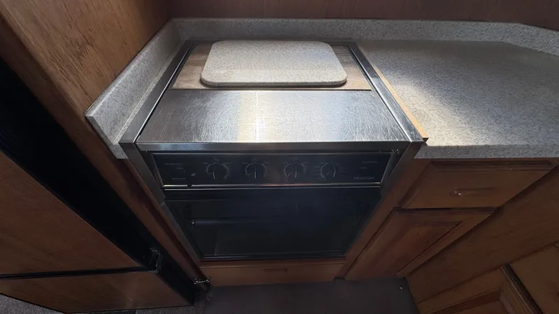 Slide: The Image of 1999 Mainship 350 Galley Oven - 13