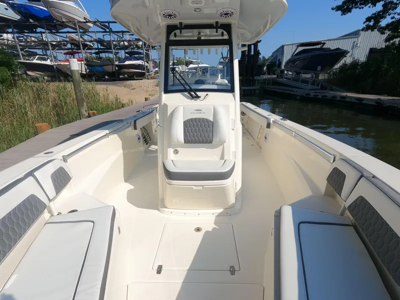 Slide: The Image of 2026 Cobia 285 Center Console boat interior with seating and console view. - 20