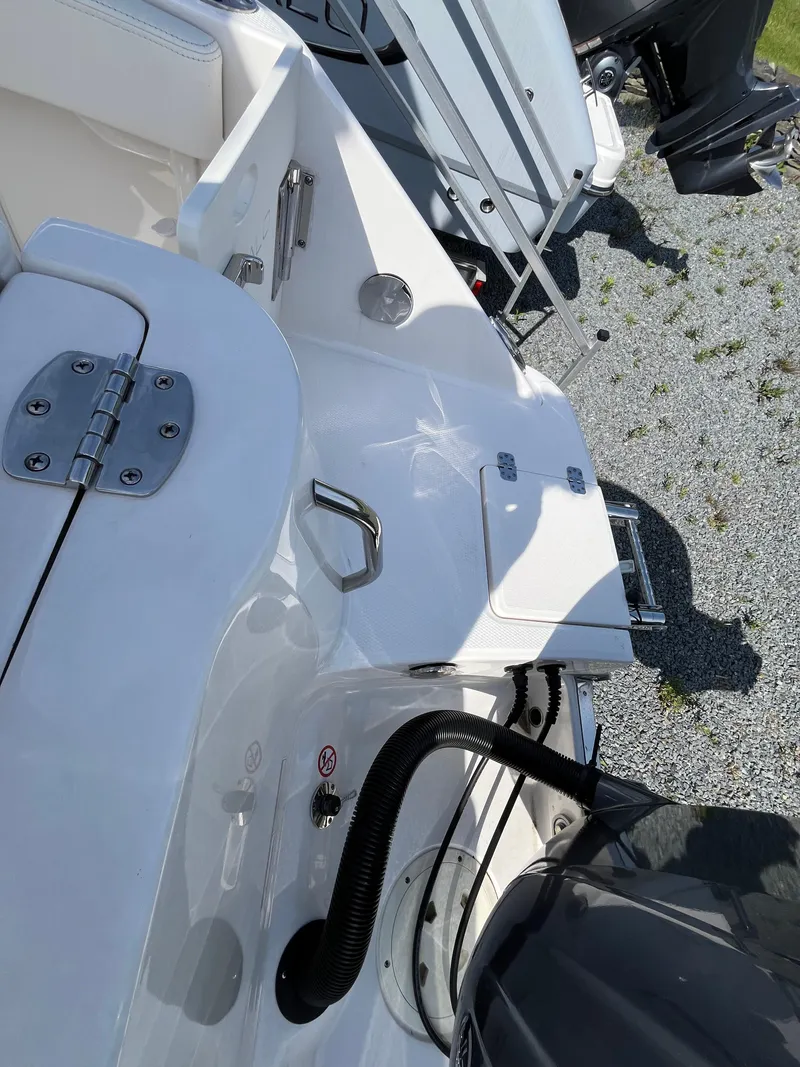 Slide: The Image of 2025 Robalo R222 Center Console boat deck with engine and fittings. - 6