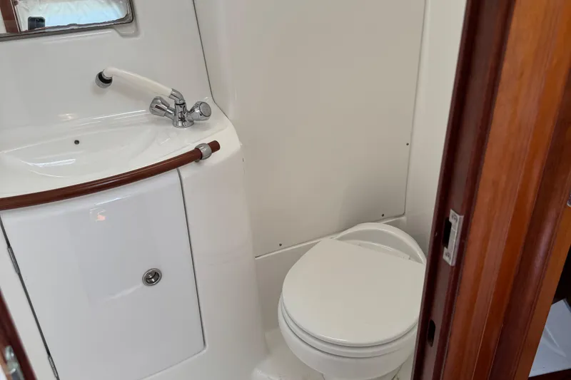 Slide: The Image of Bathroom interior of 2003 Beneteau 393 yacht with sink and toilet. - 10