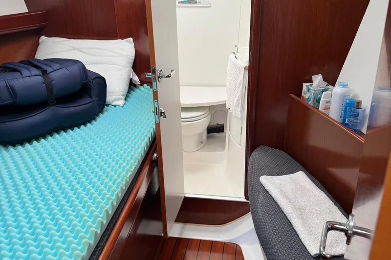 Slide: The Image of Cabin interior of 2003 Beneteau 393 yacht with bed and bathroom. - 7