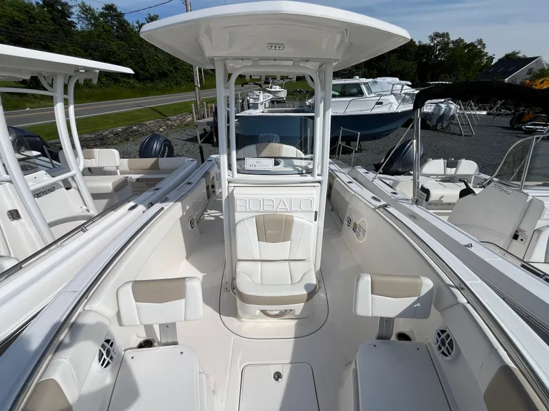 Slide: The Image of 2024 Robalo R230 Center Console boat engine and deck, viewed from above. - 12