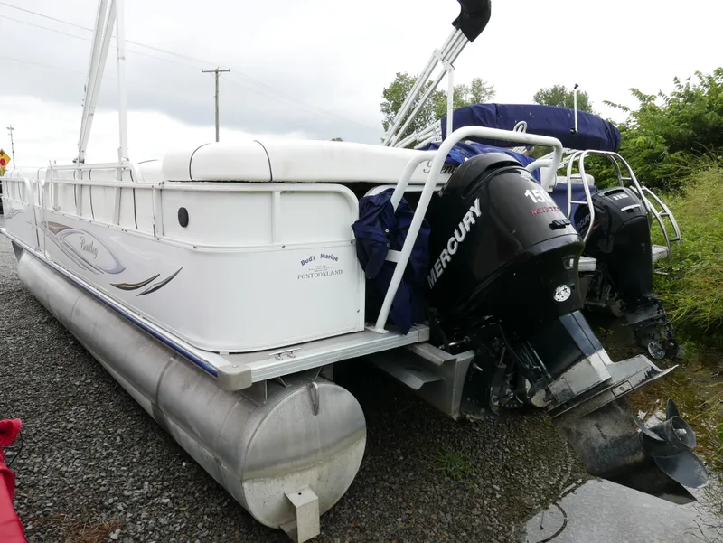 Slide: The Image of 2006 Bentley Pontoons 240 CRUISE with dual Mercury outboard motors on gravel. - 3
