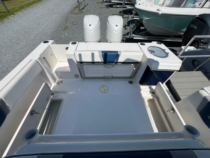 Slide: The Image of 2024 Robalo R250 Center Console boat interior with dual engines and spacious deck layout. - 15
