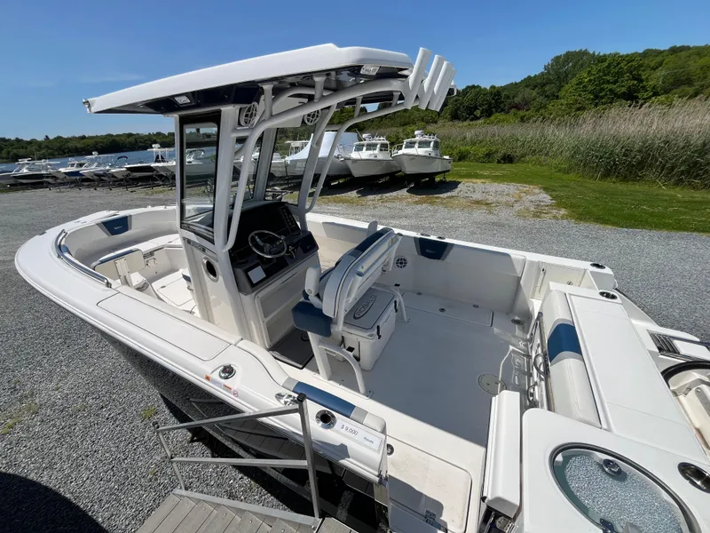 Slide: The Image of 2024 Robalo R250 Center Console boat with spacious deck and modern design. - 2