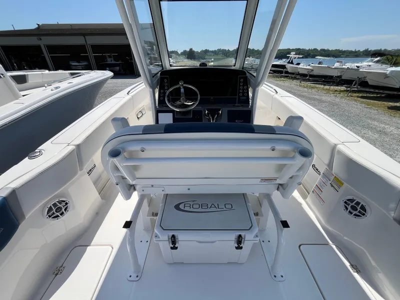 Slide: The Image of 2024 Robalo R250 Center Console boat interior with helm and seating. - 4