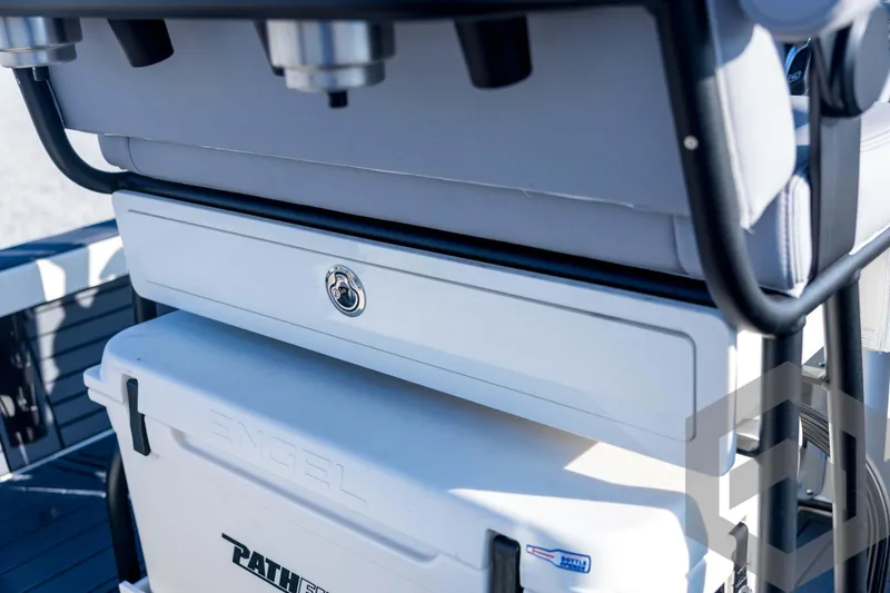 Slide: The Image of 2026 Pathfinder 2300 HPS boat interior with Engel cooler and storage compartment. - 102