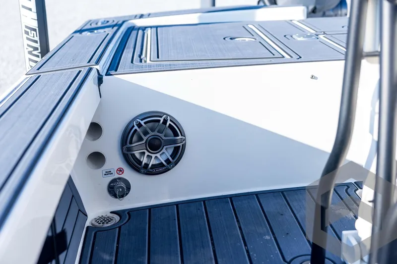 Slide: The Image of 2026 Pathfinder 2300 HPS boat interior with speaker and raw water access. - 108