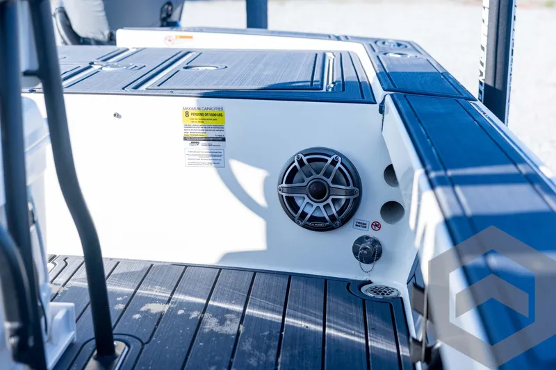Slide: The Image of 2026 Pathfinder 2300 HPS boat interior with speaker and seating area. - 109