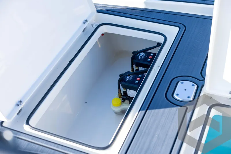 Slide: The Image of Open storage compartment on 2026 Pathfinder 2300 HPS boat, showing internal components. - 112