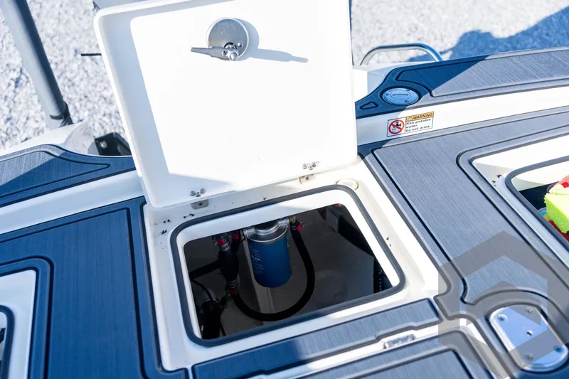 Slide: The Image of Open storage compartment on 2026 Pathfinder 2300 HPS boat, showcasing interior details. - 115