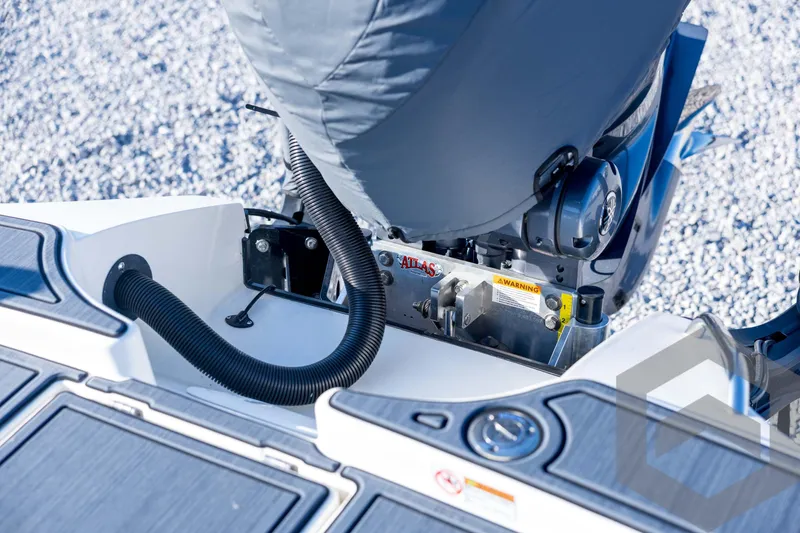 Slide: The Image of Pathfinder 2300 HPS 2026 boat engine detail with protective cover and warning label. - 117
