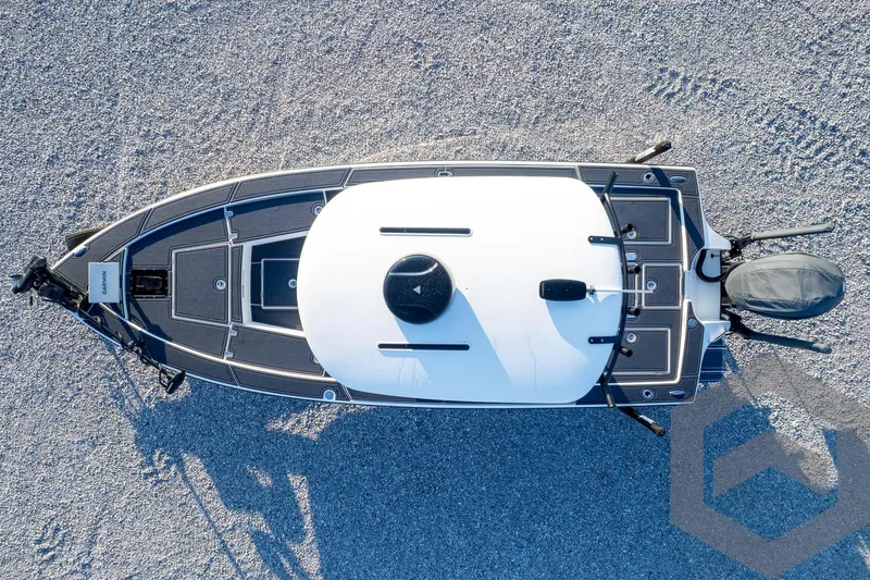 Slide: The Image of Top view of 2026 Pathfinder 2300 HPS boat on gravel surface. - 121