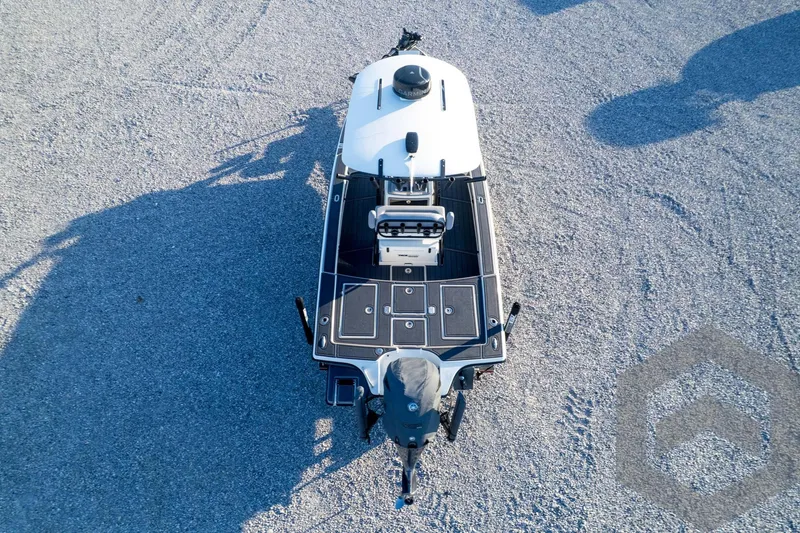 Slide: The Image of Aerial view of 2026 Pathfinder 2300 HPS boat on gravel surface. - 122