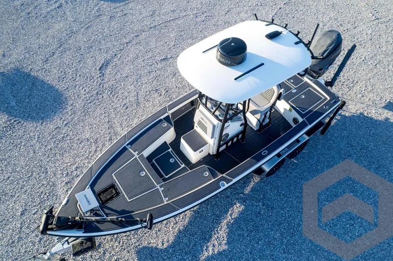 Slide: The Image of Aerial view of 2026 Pathfinder 2300 HPS boat on gravel surface. - 125