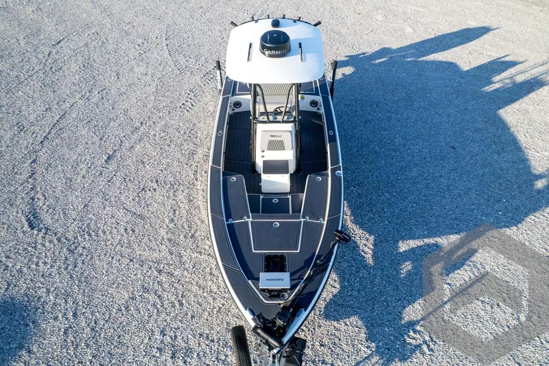 Slide: The Image of Aerial view of 2026 Pathfinder 2300 HPS boat on gravel surface. - 126