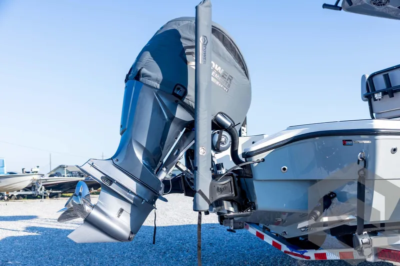 Slide: The Image of 2026 Pathfinder 2300 HPS boat with powerful outboard motor, displayed on a trailer. - 19