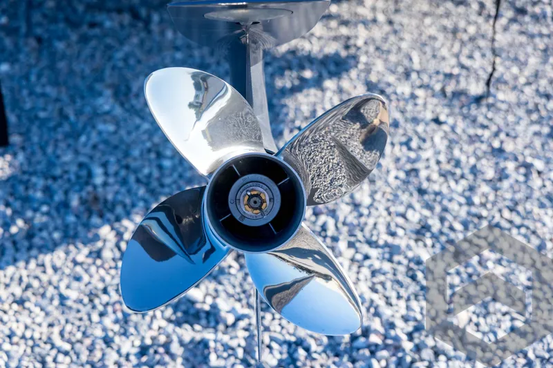 Slide: The Image of Shiny propeller of 2026 Pathfinder 2300 HPS boat on gravel background. - 22