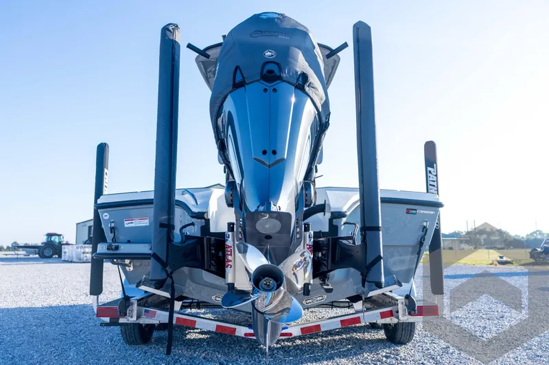 Slide: The Image of 2026 Pathfinder 2300 HPS boat on trailer, rear view with motor and stabilizers. - 23