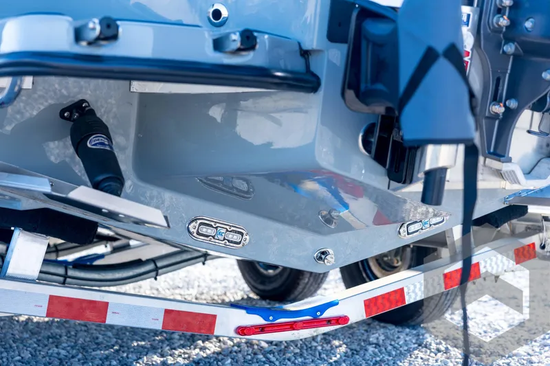 Slide: The Image of 2026 Pathfinder 2300 HPS boat trailer close-up with reflective details. - 25